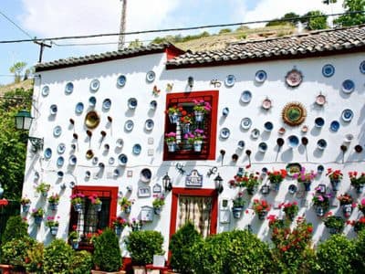 Traditional granadian house with ceramic decorative plates in its walls